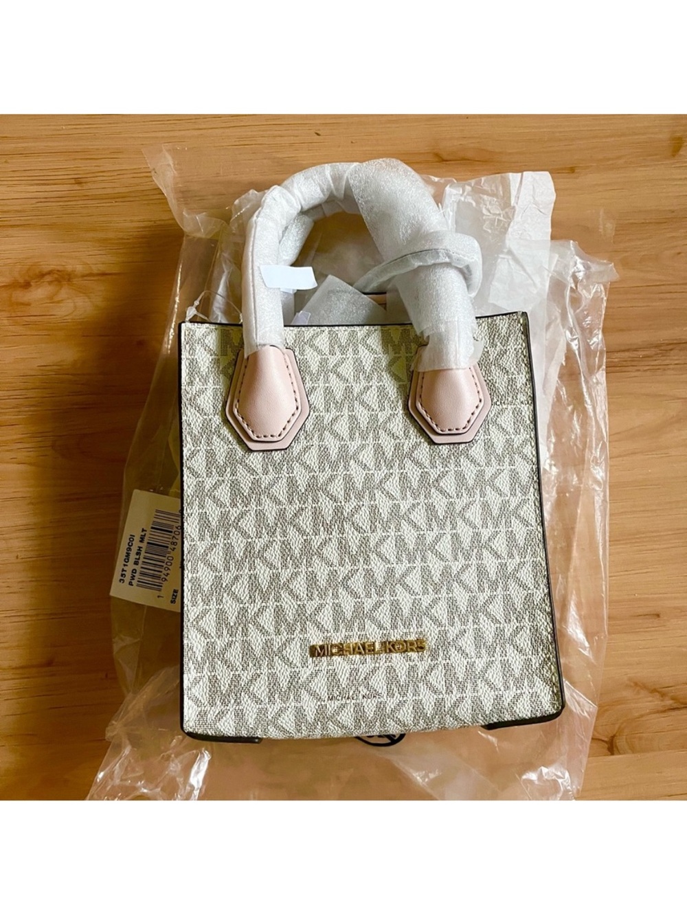 Michael Kors Mercer Extra-Small Logo and Leather
Crossbody Bag Powder Pink - Picture 3 of 4